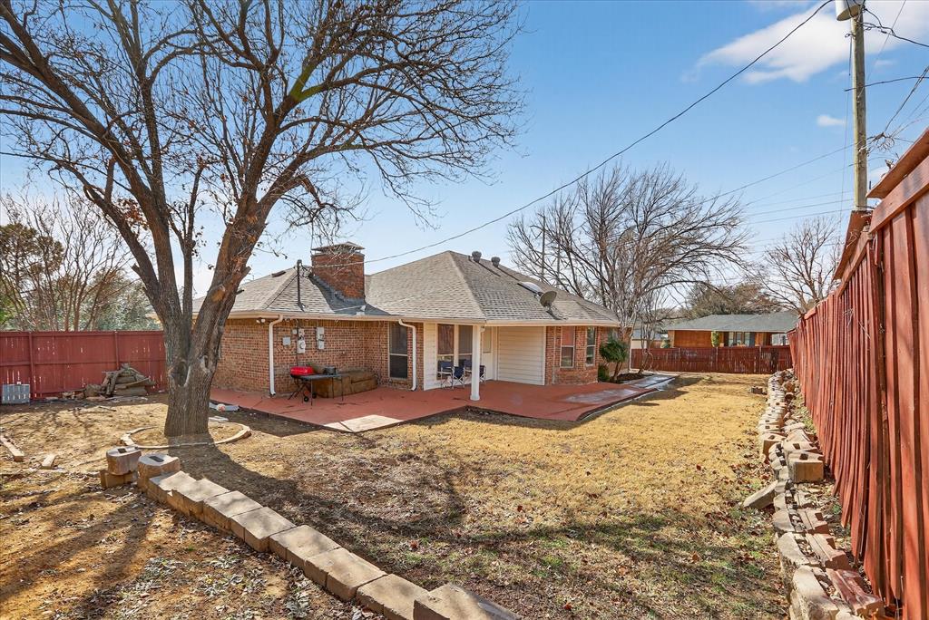 2010 Libby Lane Grand Prairie, TX 75050 - Photo 22 of 24 a view of a house with a yard covered in snow