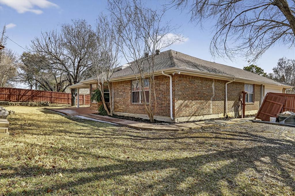 2010 Libby Lane Grand Prairie, TX 75050 - Photo 23 of 24 a view of a house with a yard covered in snow