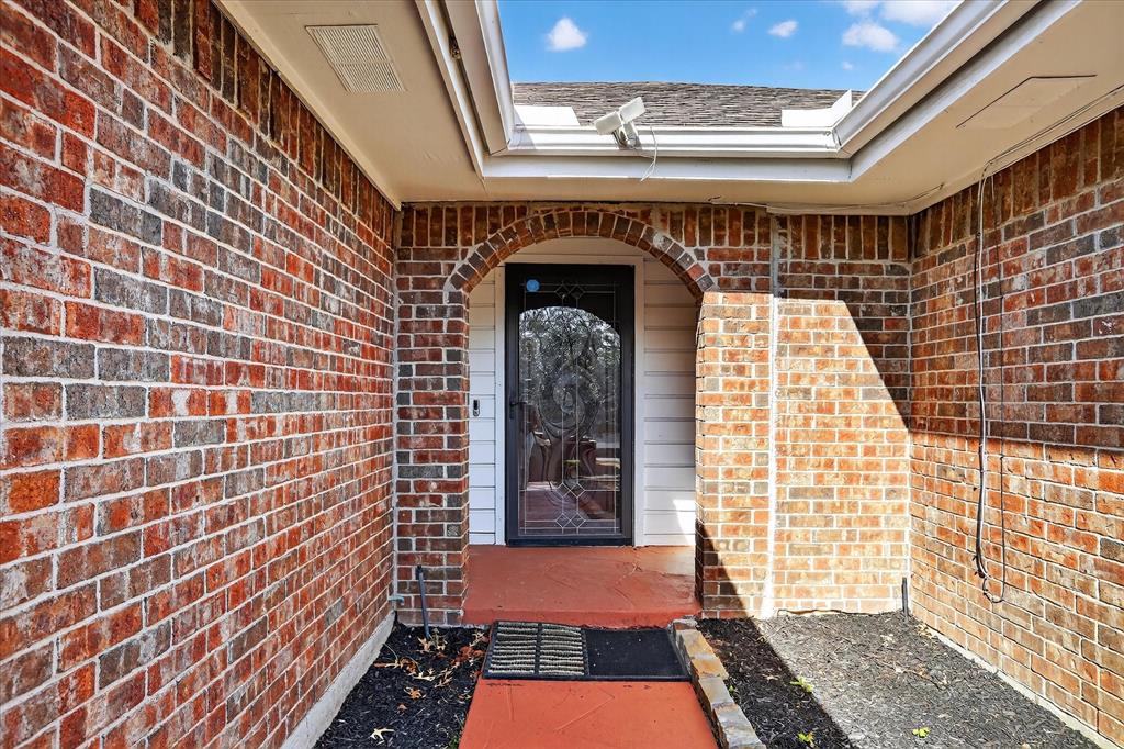 2010 Libby Lane Grand Prairie, TX 75050 - Photo 3 of 24 a view of wooden door with a balcony