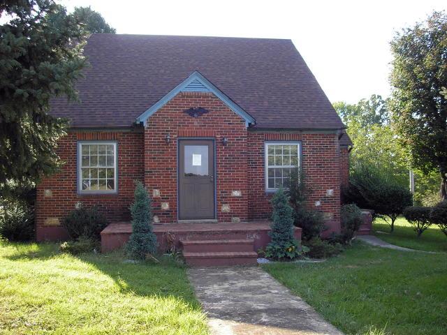 8357 Snow Creek Road Penhook, VA 24137 - Photo 1 of 8 a front view of a house with garden