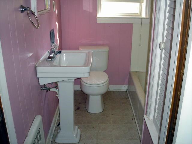 8357 Snow Creek Road Penhook, VA 24137 - Photo 2 of 8 a bathroom with a sink a toilet and a mirror