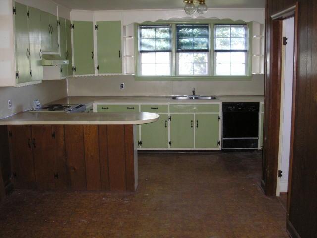 8357 Snow Creek Road Penhook, VA 24137 - Photo 3 of 8 a room with a sink cabinets and a window