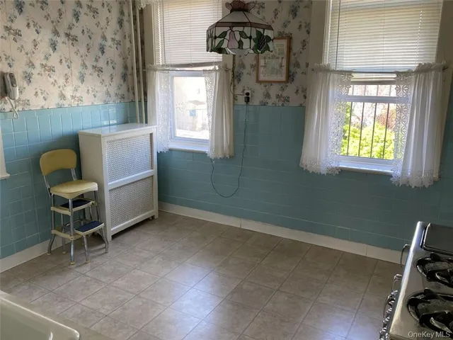 a view of a dining room with furniture and window