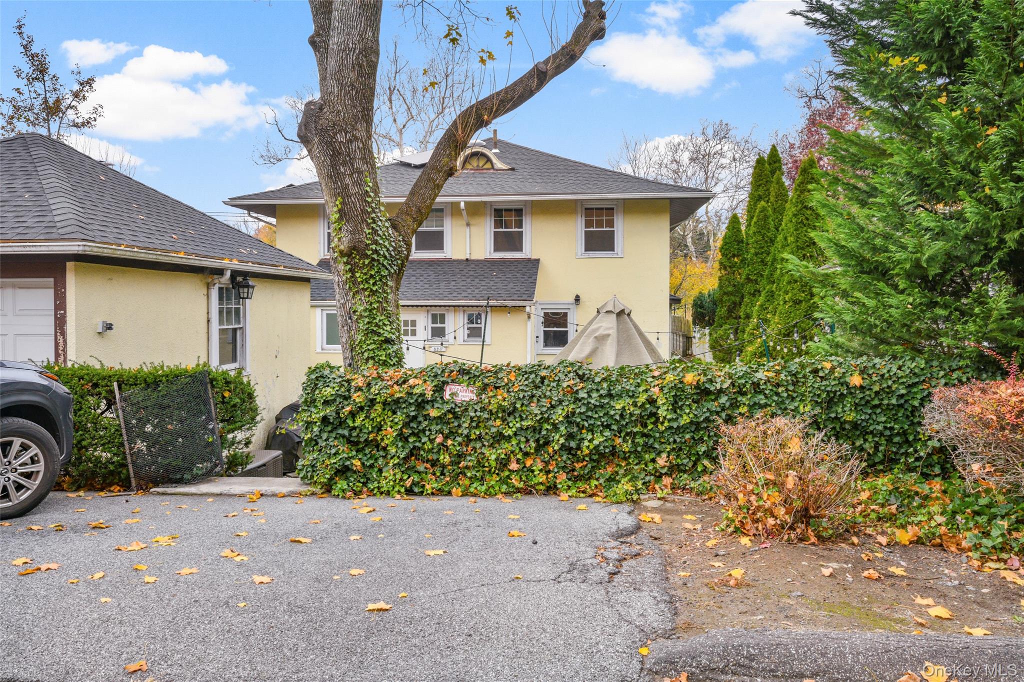 330 First Avenue, Unit LEFT SIDE Pelham, NY 10803 - Photo 15 of 19 a front view of a house with garden