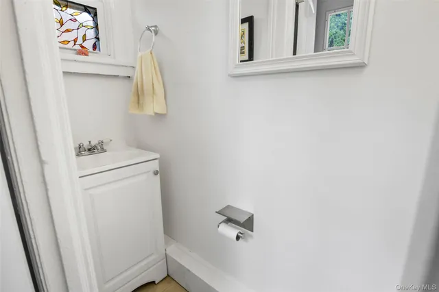 a bathroom with a sink and a window