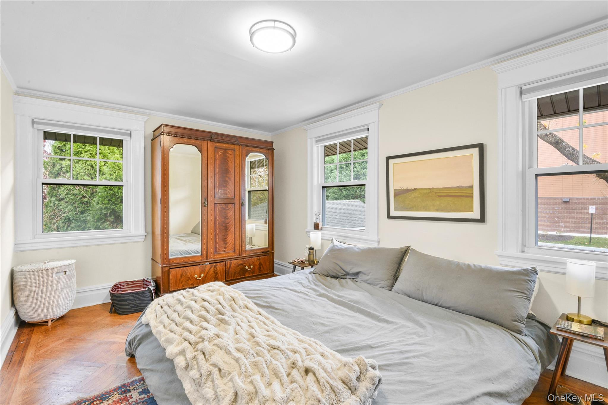 330 First Avenue, Unit LEFT SIDE Pelham, NY 10803 - Photo 9 of 19 a bedroom with a large bed and a window