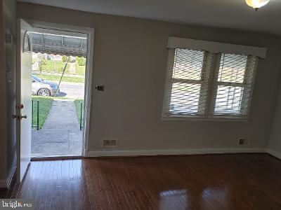 1547 East Cold Spring Lane Baltimore, MD 21218 - Photo 3 of 16 livingroom and front door