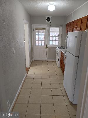 1547 East Cold Spring Lane Baltimore, MD 21218 - Photo 7 of 16 kitchen and back door
