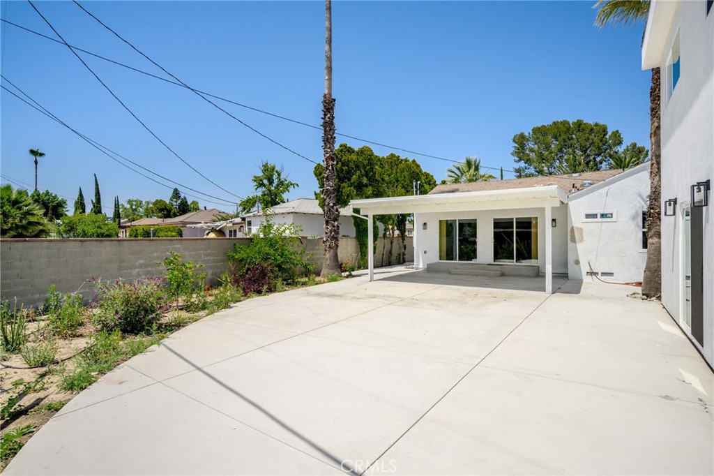 8435 Rincon Avenue Sun Valley, CA 91352 - Photo 19 of 61 a front view of a house with garden