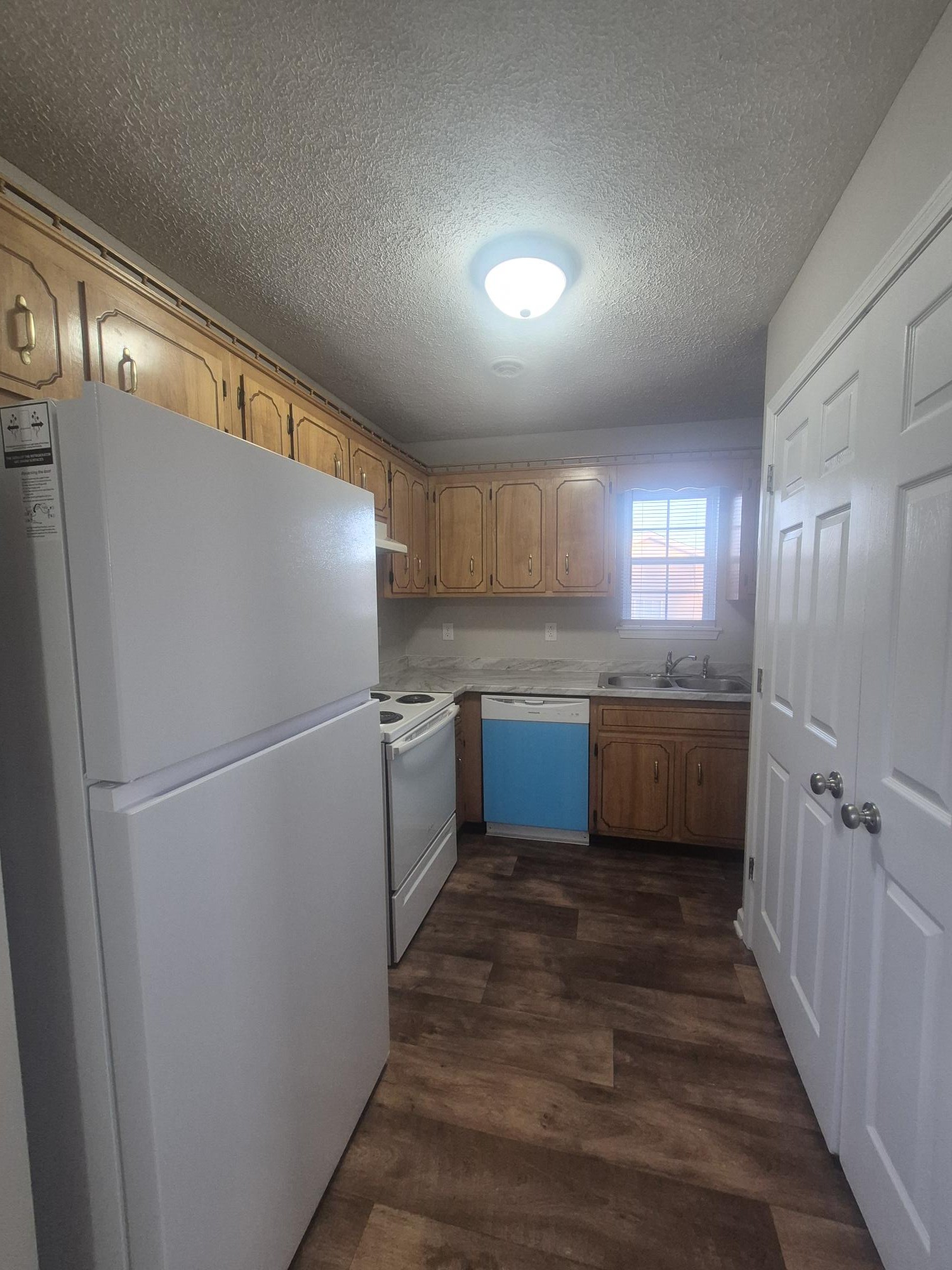 403 Eddy Street Oak Grove, KY 42262 - Photo 5 of 13 a kitchen with a refrigerator a sink and a dishwasher