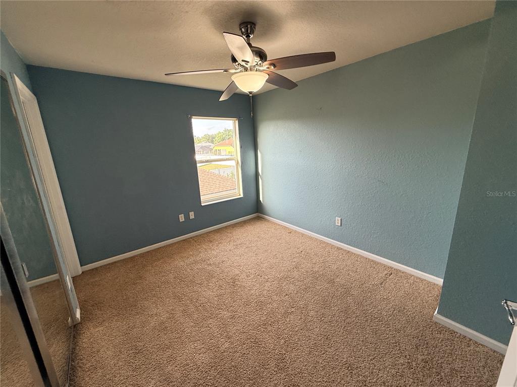 4199 Southwest 46th Court Ocala, FL 34474 - Photo 36 of 50 an empty room with windows and fan