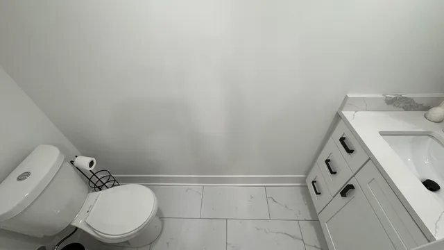 a bathroom with a sink and toilet