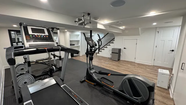 a view of gym equipment and kitchen view