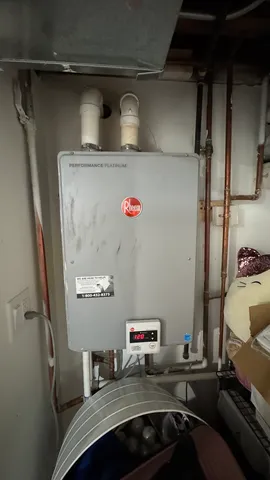 a view of storage and utility room with two washing machine