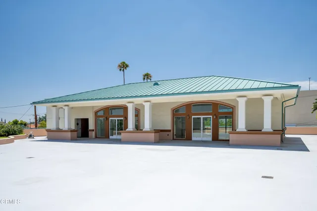 a front view of a house with a outdoor space