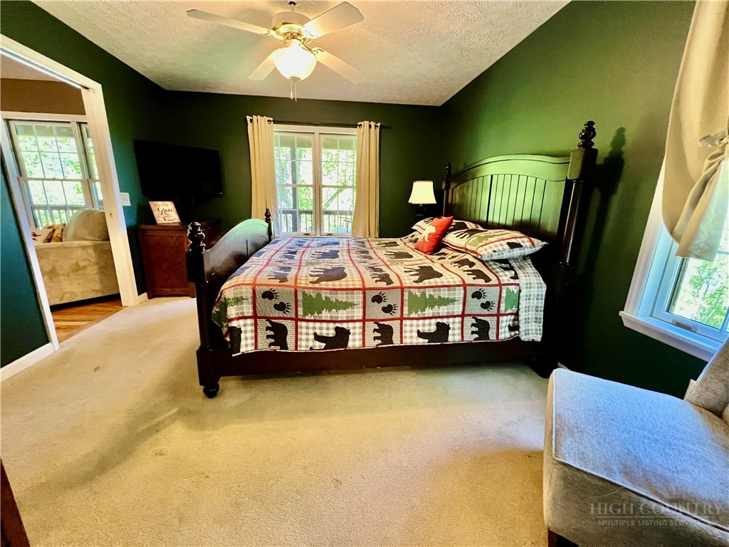 139 New River Ridge Estates Laurel Springs, NC 28644 - Photo 13 of 34 a bedroom with a bed chair and dresser