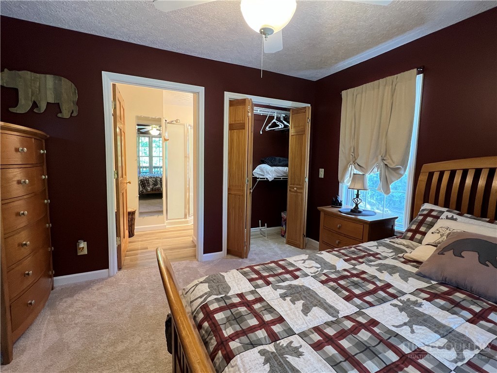 139 New River Ridge Estates Laurel Springs, NC 28644 - Photo 20 of 34 a bedroom with a bed and a dresser