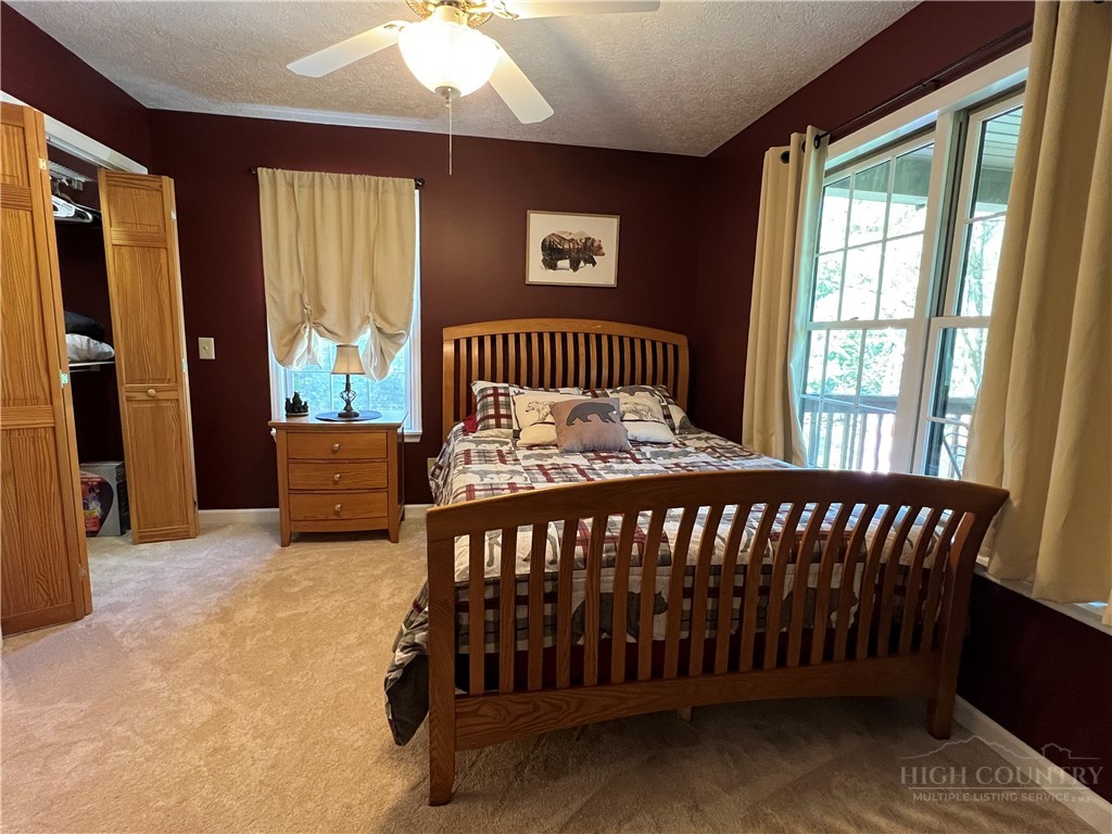 139 New River Ridge Estates Laurel Springs, NC 28644 - Photo 21 of 34 a bedroom with a bed and a window