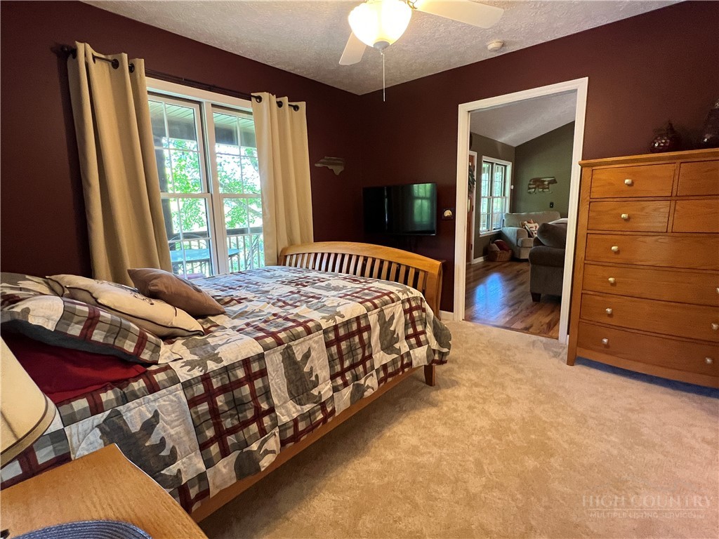 139 New River Ridge Estates Laurel Springs, NC 28644 - Photo 22 of 34 a bedroom with a bed and a dresser