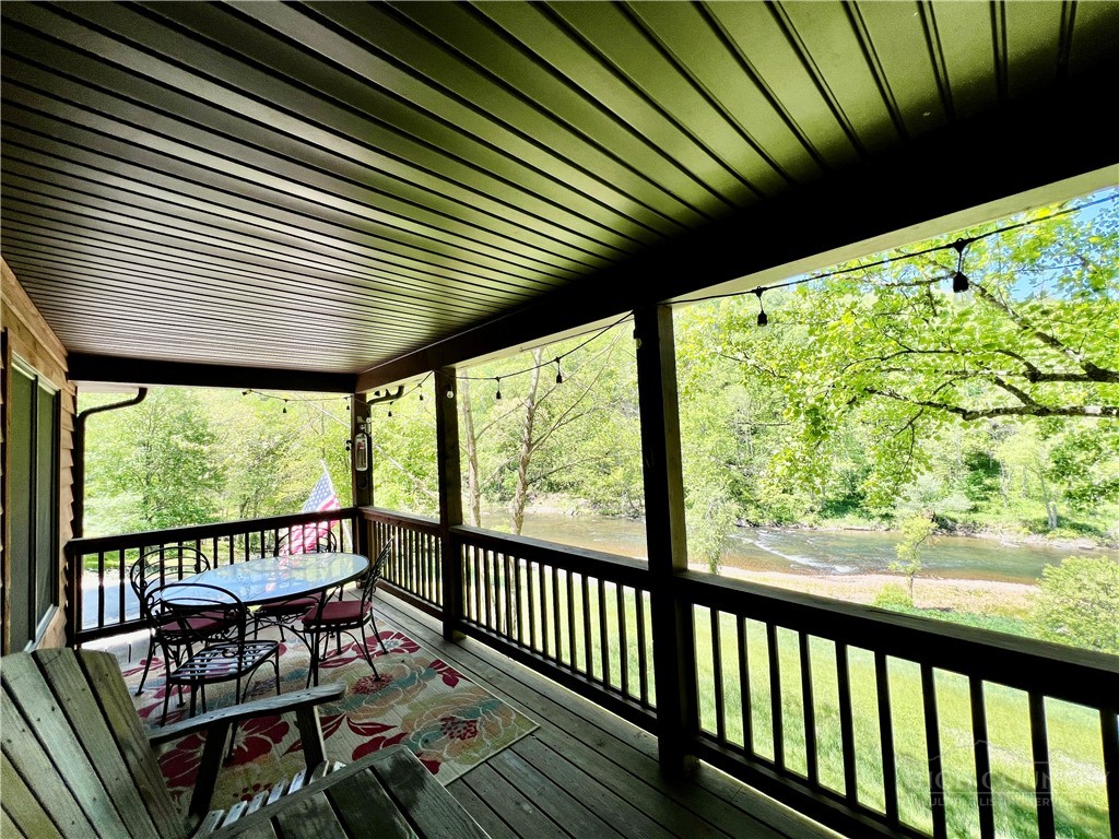 139 New River Ridge Estates Laurel Springs, NC 28644 - Photo 29 of 34 a view of a chairs and table in the balcony