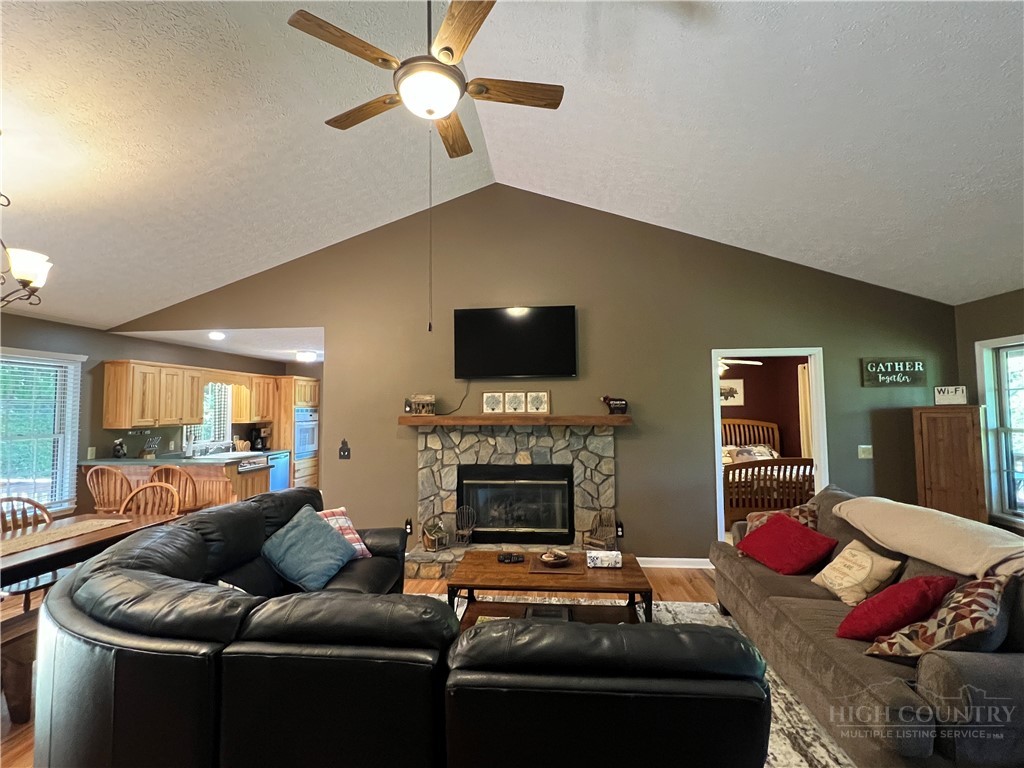 139 New River Ridge Estates Laurel Springs, NC 28644 - Photo 5 of 34 a living room with furniture and a fireplace