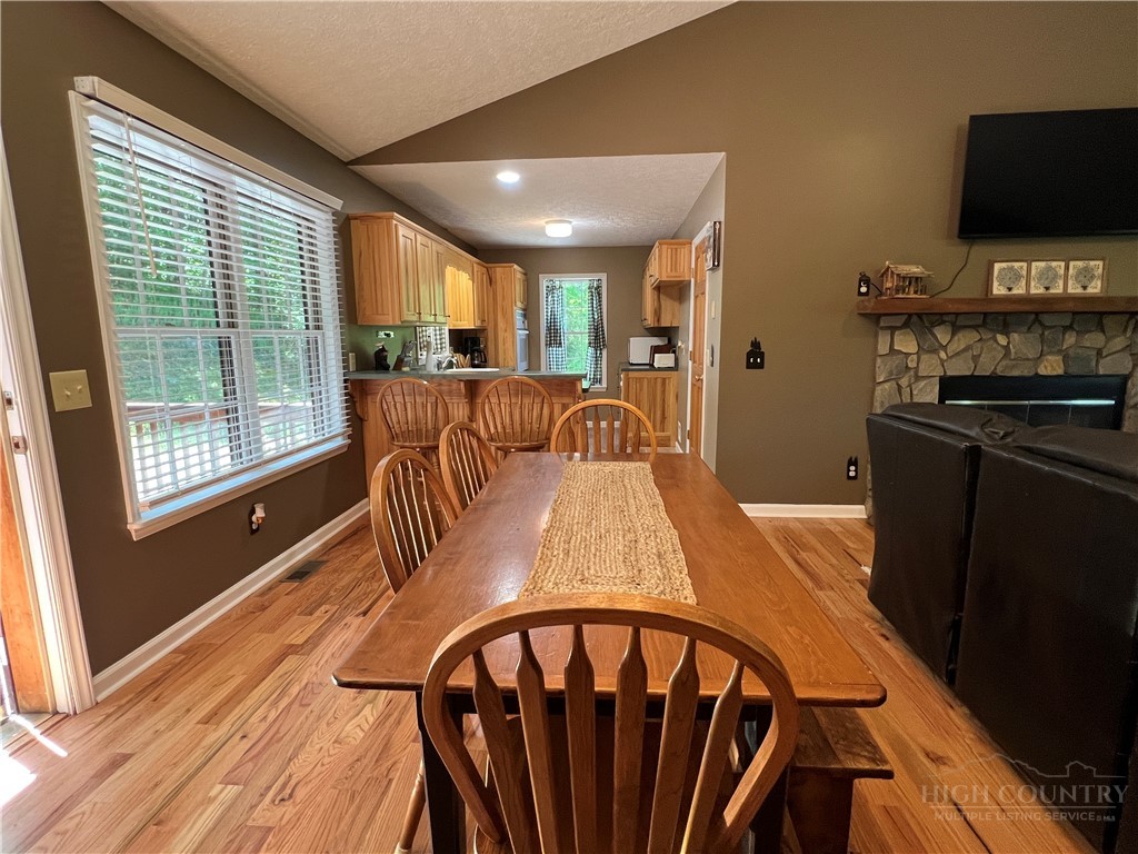 139 New River Ridge Estates Laurel Springs, NC 28644 - Photo 8 of 34 a view of a dining room with furniture window and wooden floor