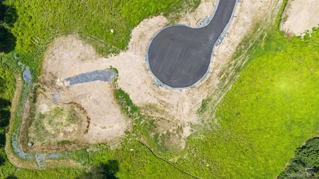 an aerial view of residential house with outdoor space