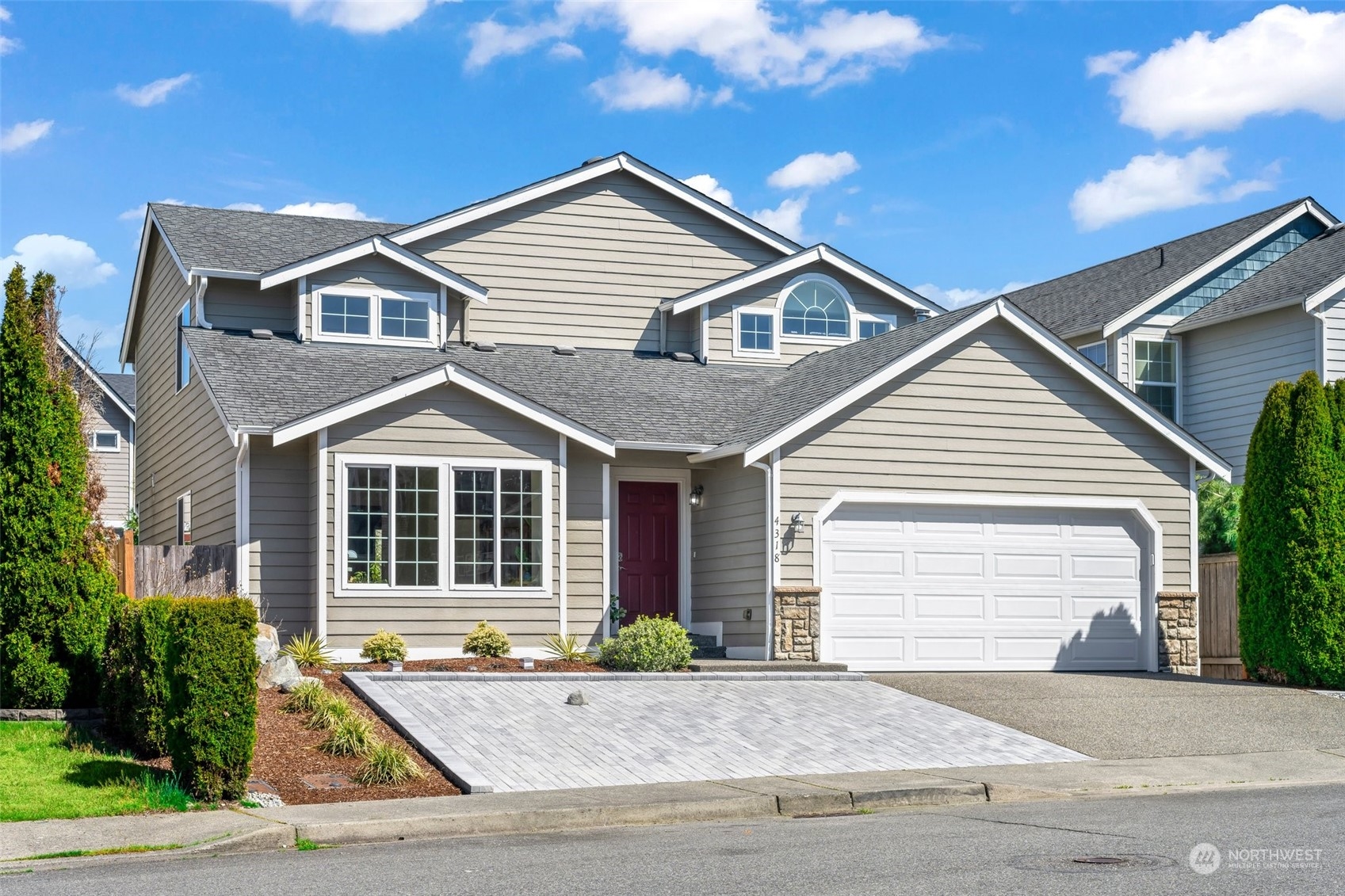 4318 Northeast 2nd Court Renton, WA 98059 - Photo 1 of 29 a view of a white house with a large windows and potted plants