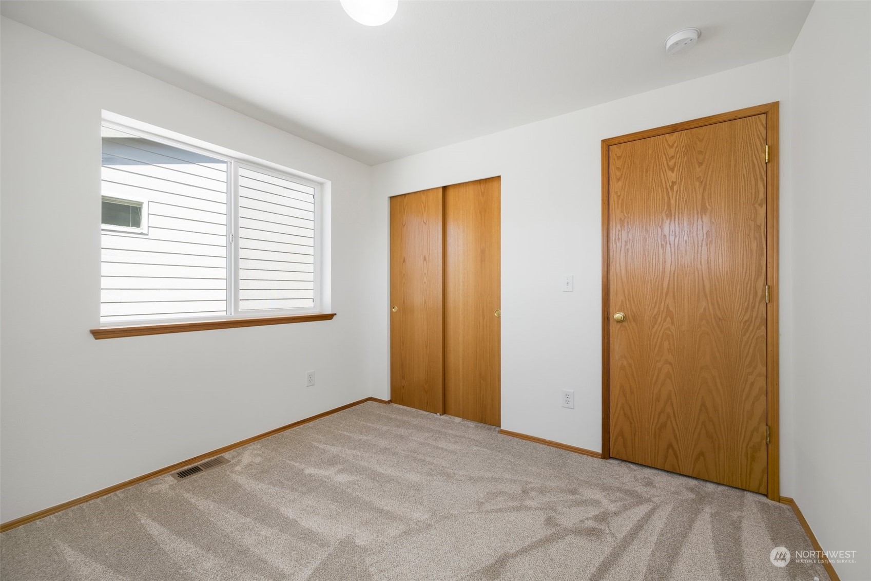 4318 Northeast 2nd Court Renton, WA 98059 - Photo 14 of 29 a view of empty room with windows