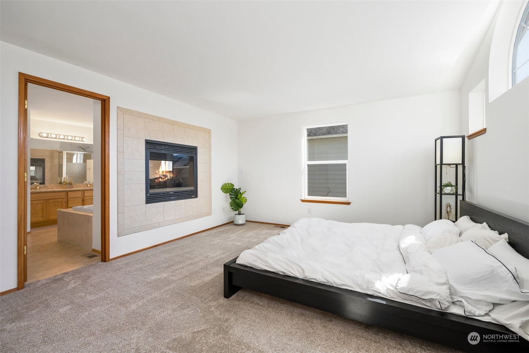 4318 Northeast 2nd Court Renton, WA 98059 - Photo 15 of 29 a bedroom with a bed and a window