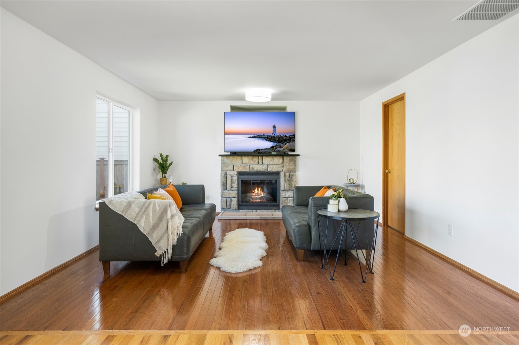 4318 Northeast 2nd Court Renton, WA 98059 - Photo 2 of 29 a living room with furniture and a fireplace