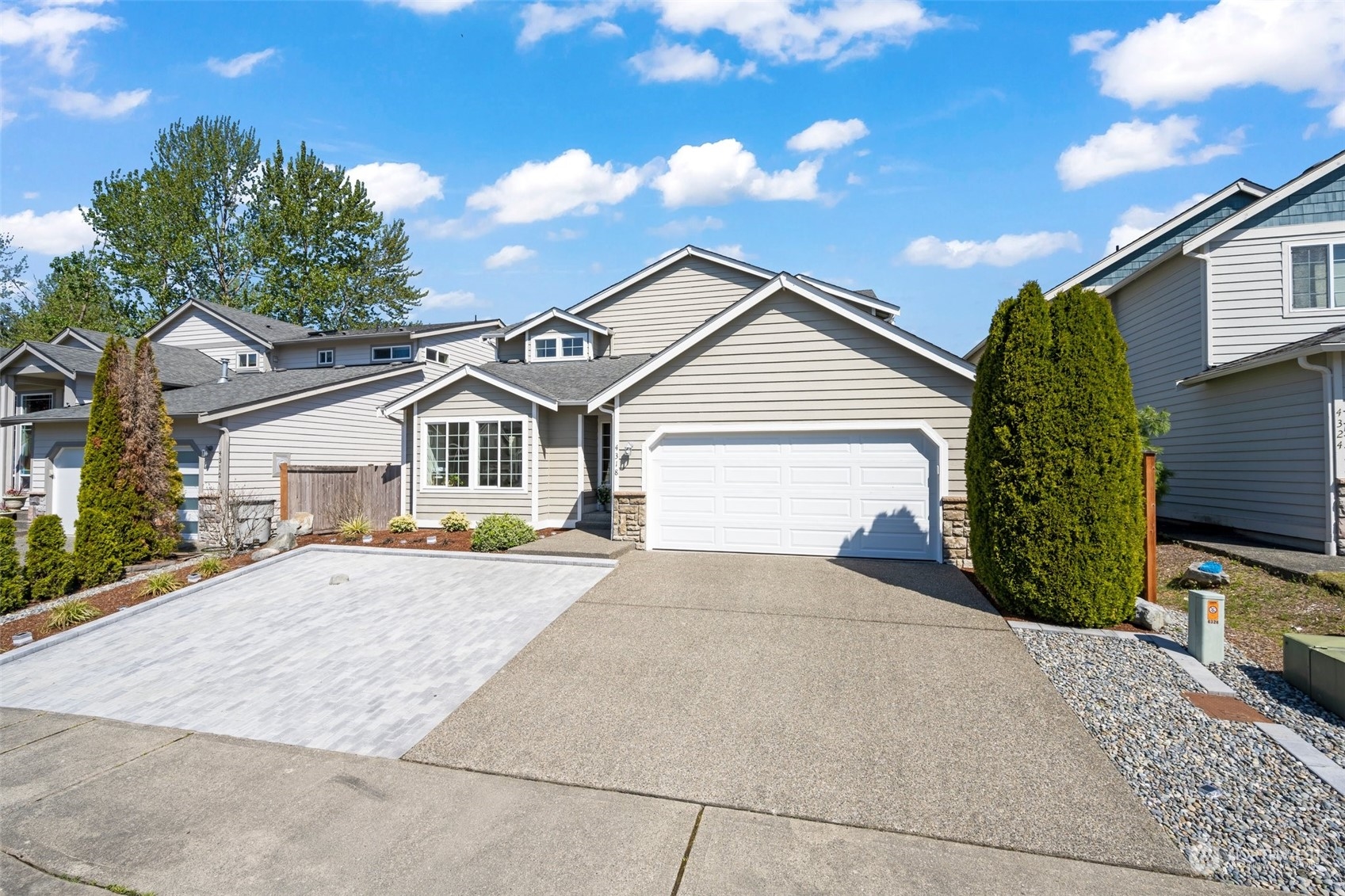 4318 Northeast 2nd Court Renton, WA 98059 - Photo 26 of 29 a view of a house with a yard and garage