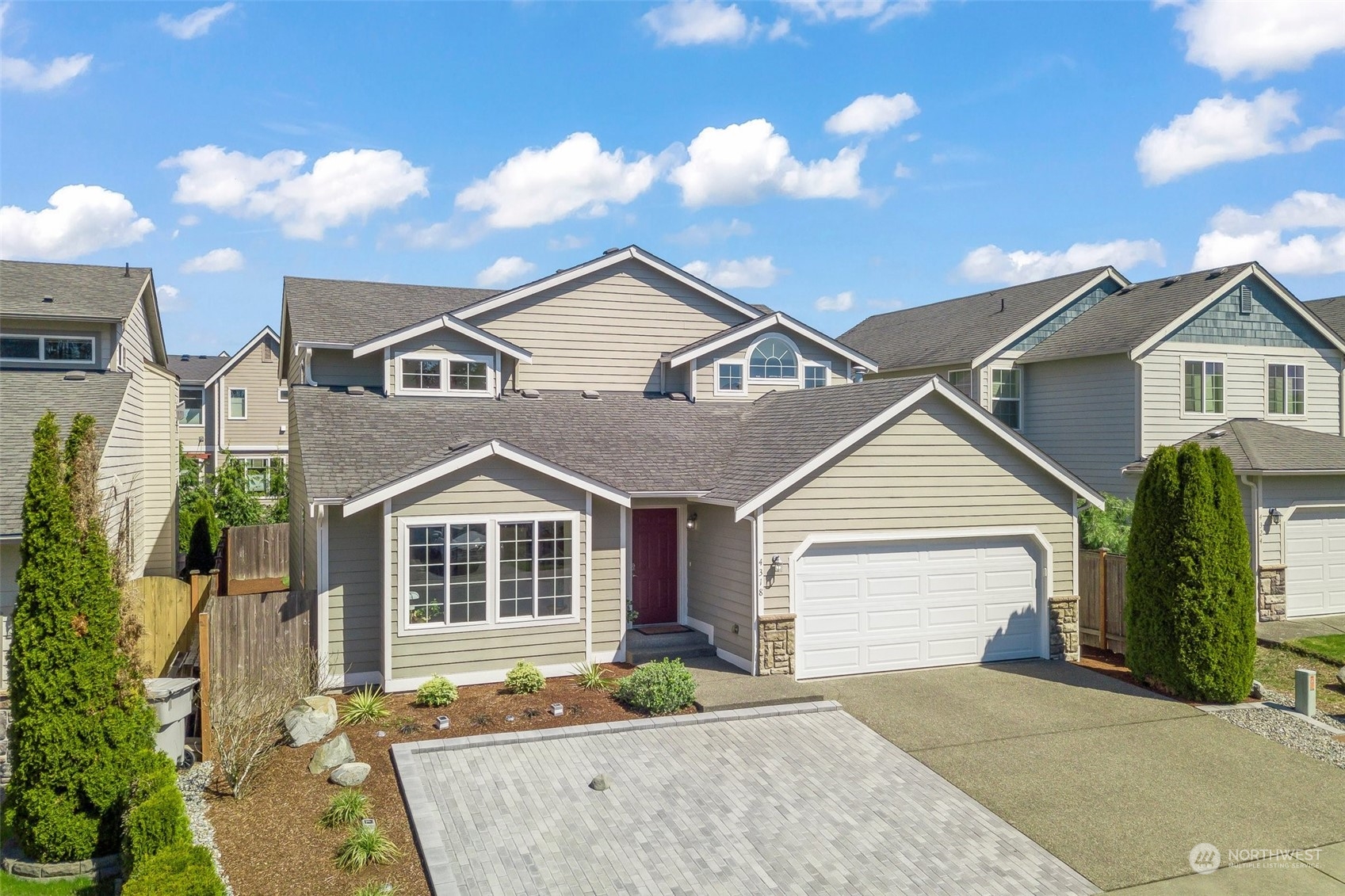 4318 Northeast 2nd Court Renton, WA 98059 - Photo 28 of 29 a front view of a house with a garden and plants