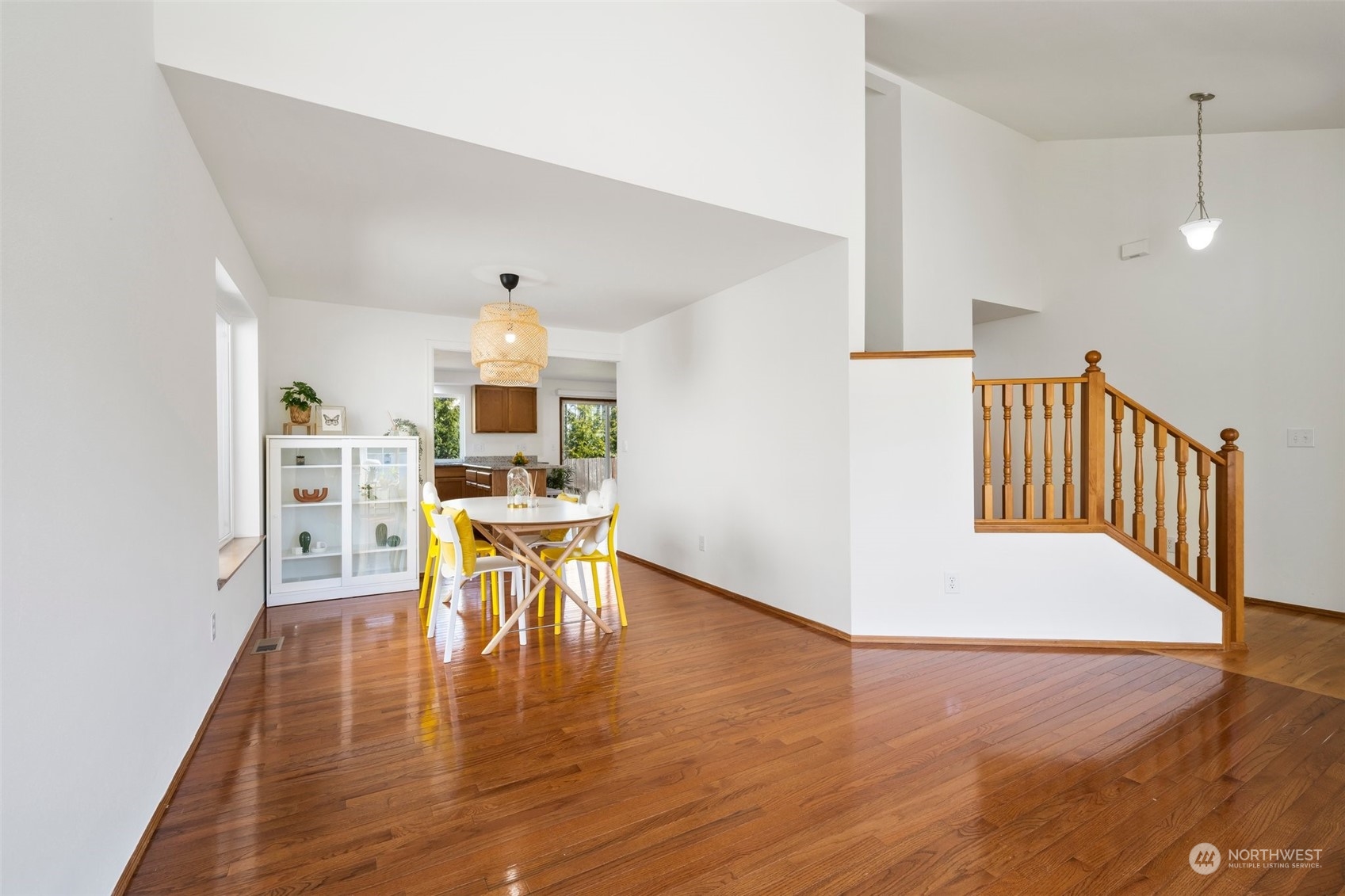 4318 Northeast 2nd Court Renton, WA 98059 - Photo 10 of 29 a view of a dining room with furniture wooden floor and chandelier