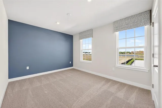 an aerial view of a house with a lake view