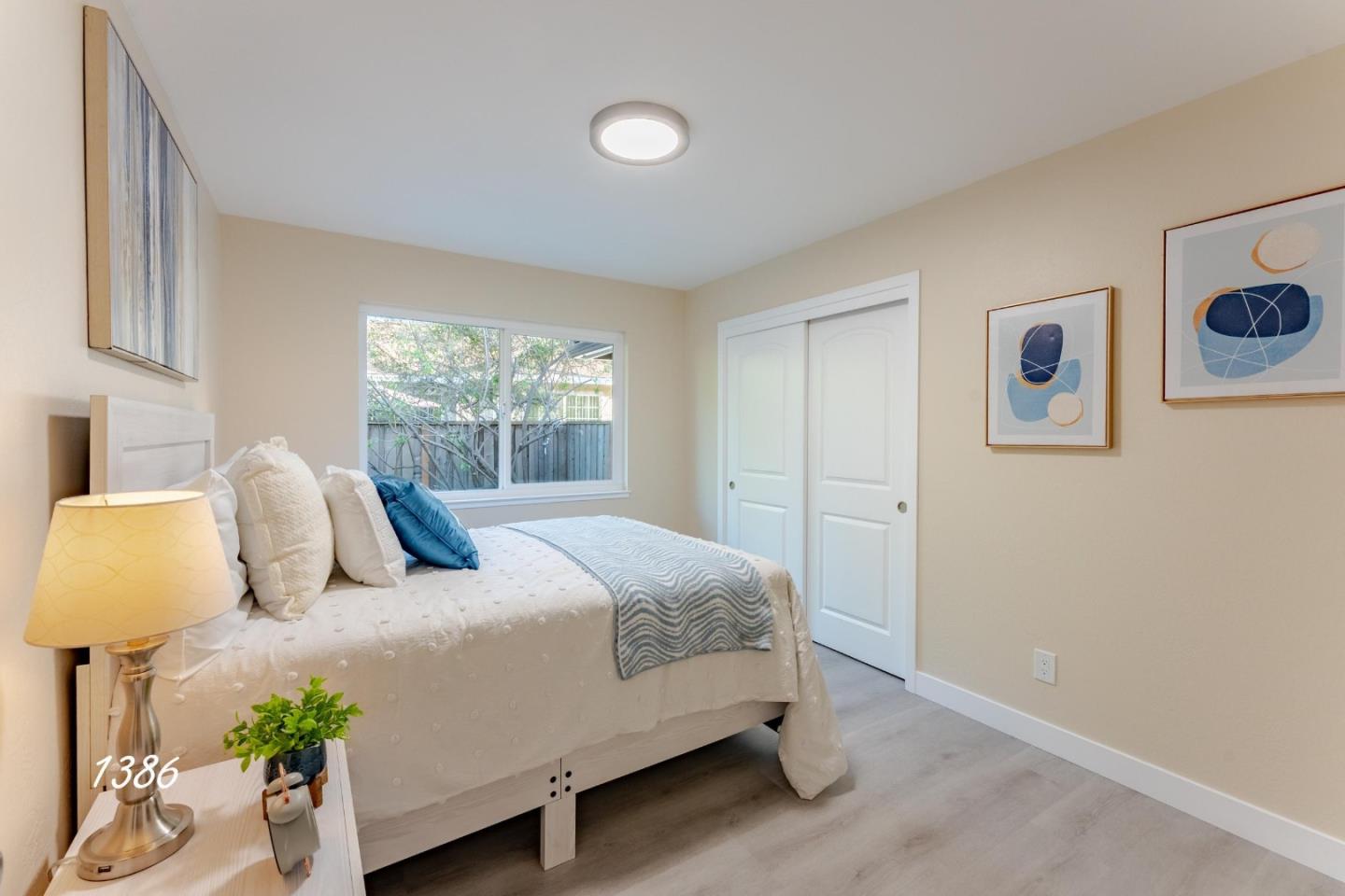 1384 Darryl Drive San Jose, CA 95130 - Photo 17 of 34 a bedroom with a bed and wooden floor