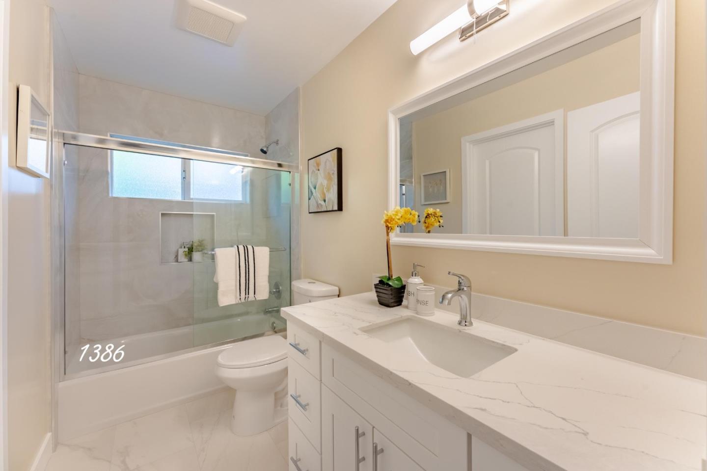1384 Darryl Drive San Jose, CA 95130 - Photo 18 of 34 a bathroom with a sink a toilet and shower