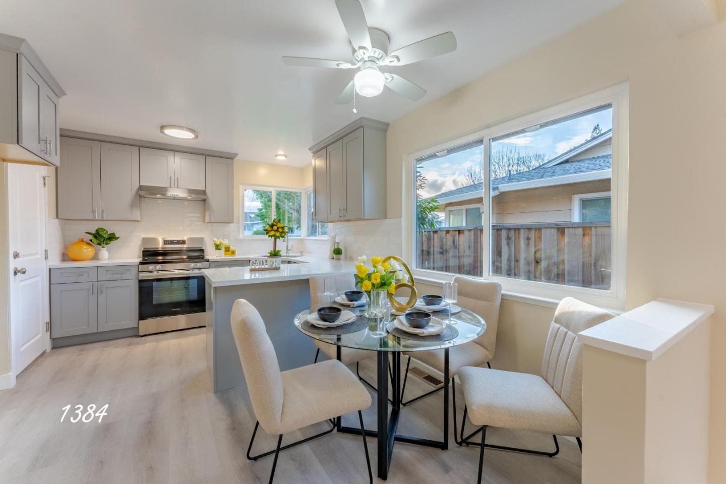 1384 Darryl Drive San Jose, CA 95130 - Photo 23 of 34 a kitchen with a dining table chairs and white appliances