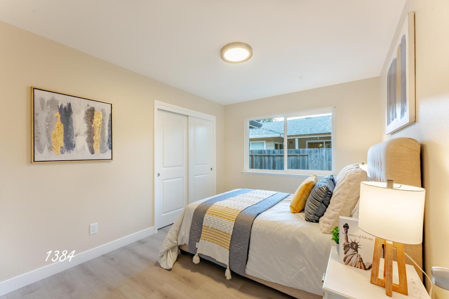 1384 Darryl Drive San Jose, CA 95130 - Photo 26 of 34 a bedroom with a bed and wooden floor