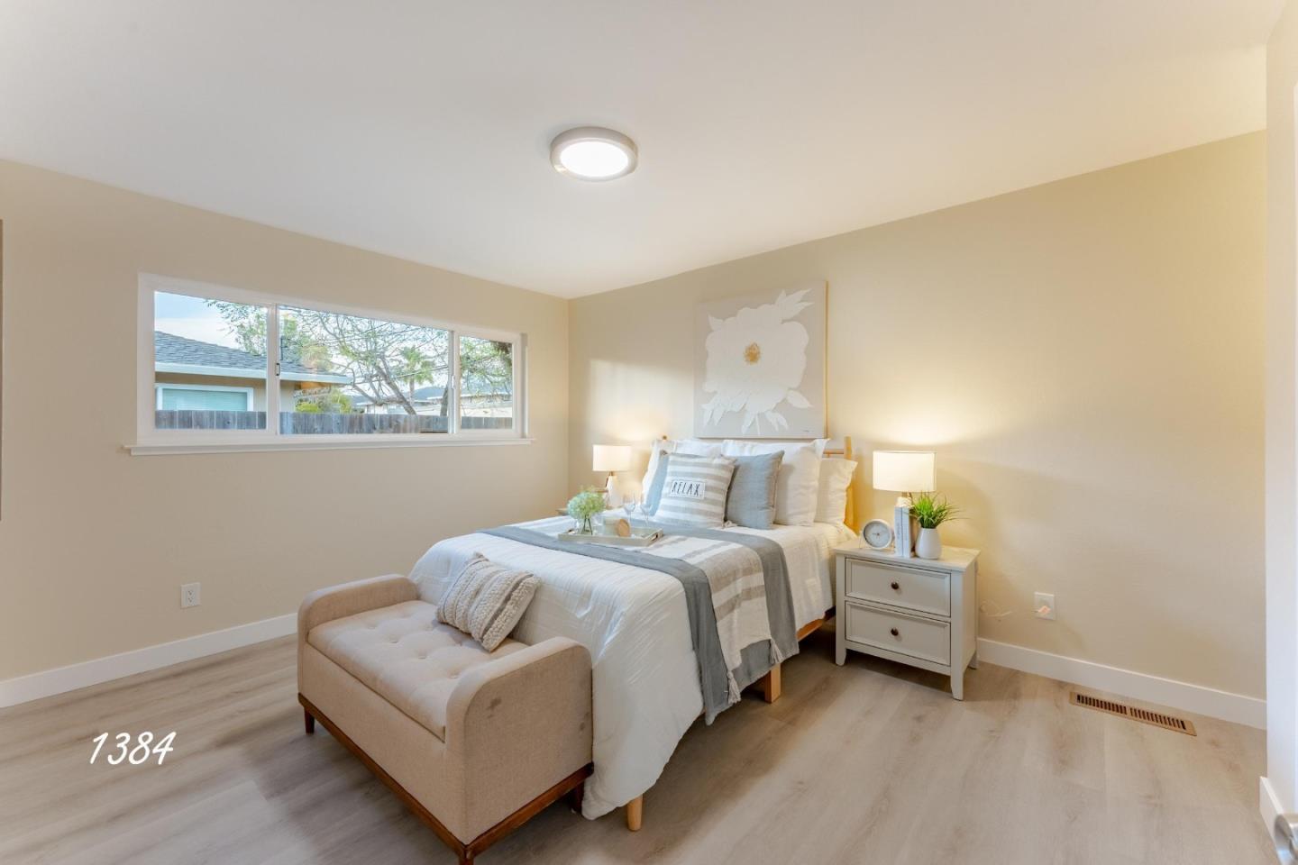 1384 Darryl Drive San Jose, CA 95130 - Photo 28 of 34 a bedroom with a bed and a lamp