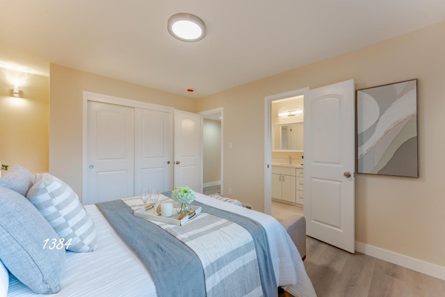 1384 Darryl Drive San Jose, CA 95130 - Photo 29 of 34 a bedroom with a bed and a painting on the wall