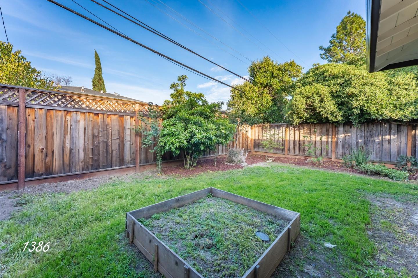 1384 Darryl Drive San Jose, CA 95130 - Photo 7 of 34 a view of a backyard with a small cabin and wooden fence