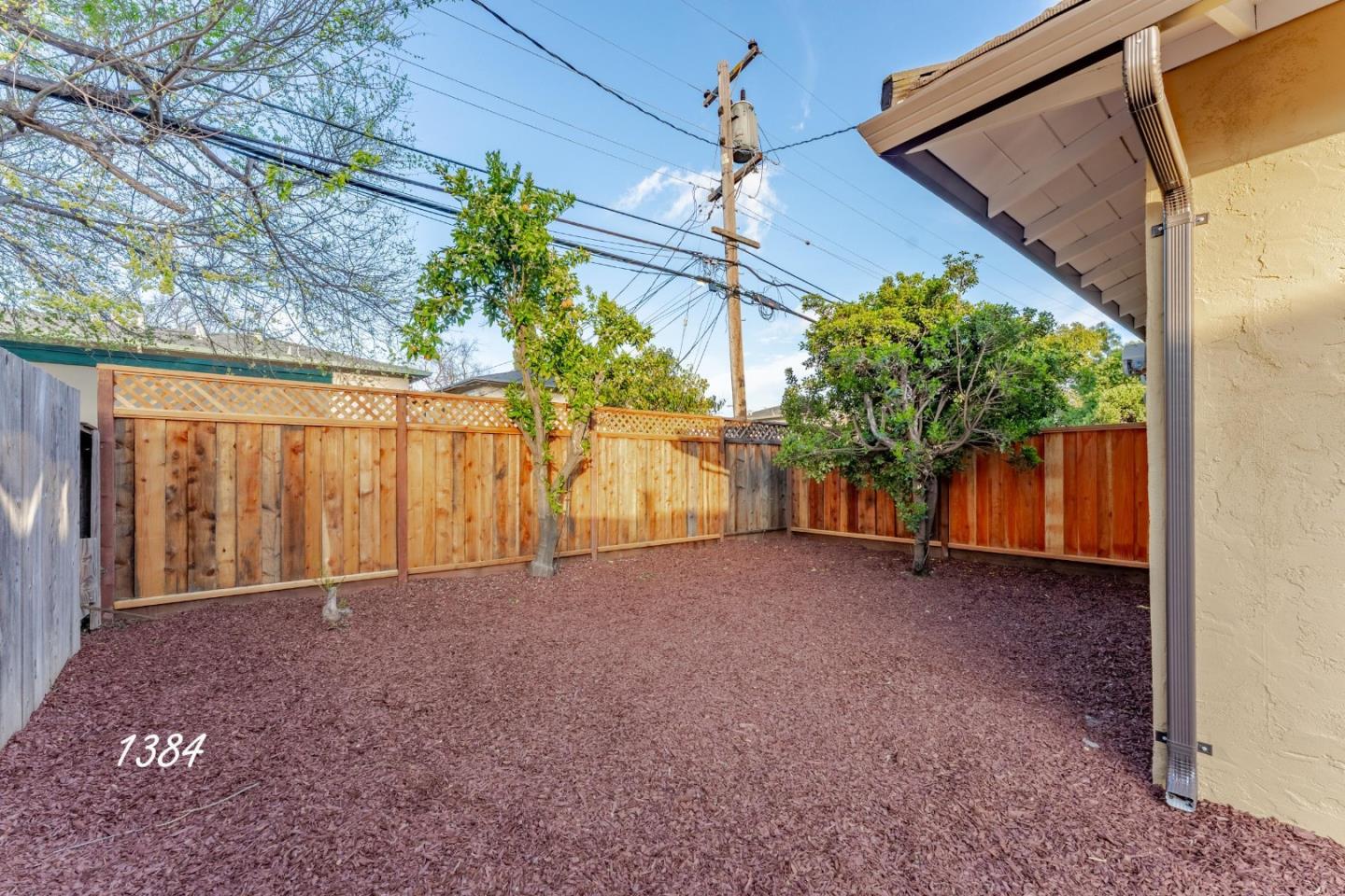 1384 Darryl Drive San Jose, CA 95130 - Photo 10 of 34 a view of a house with a yard and garage