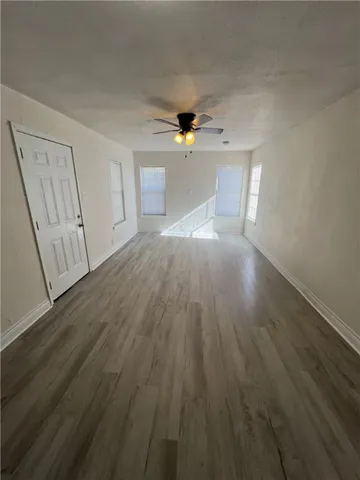 a view of a livingroom with wooden floor