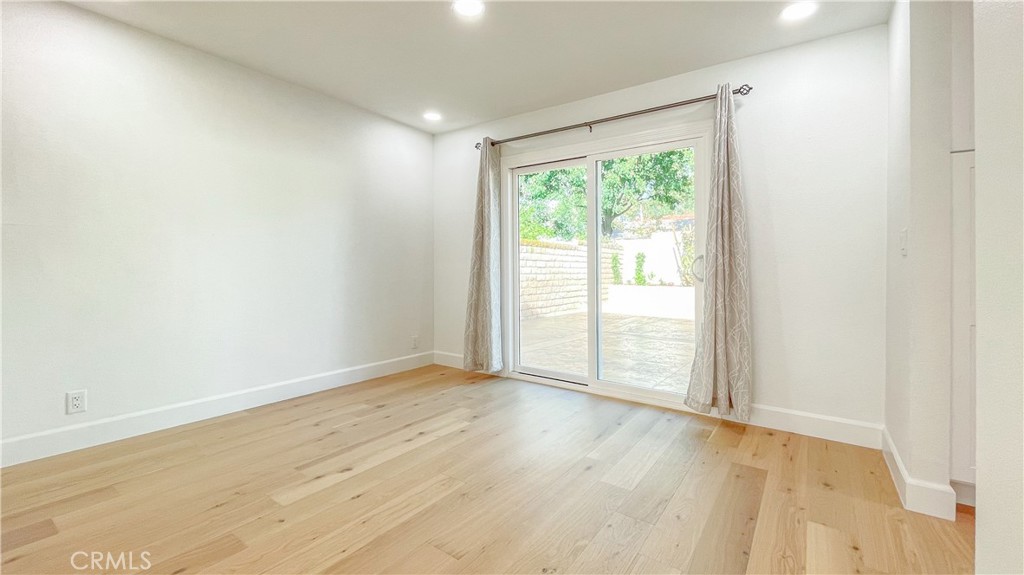 45 Westport Irvine, CA 92620 - Photo 22 of 45 an empty room with wooden floor and windows