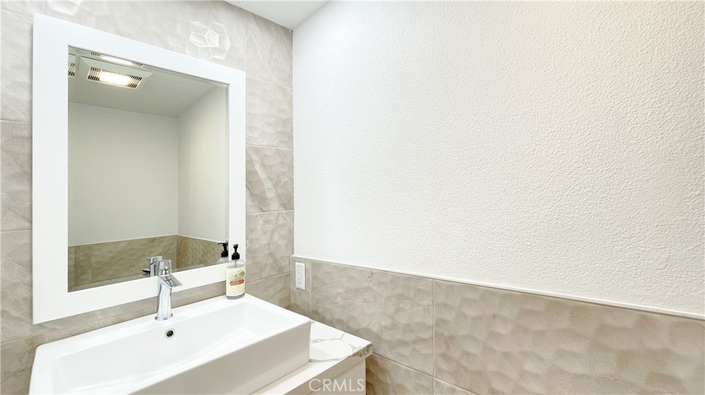 45 Westport Irvine, CA 92620 - Photo 23 of 45 a bathroom with a sink and a mirror