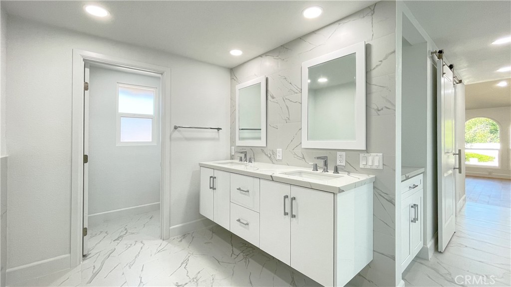 45 Westport Irvine, CA 92620 - Photo 34 of 45 a bathroom with a granite countertop sink mirror and double