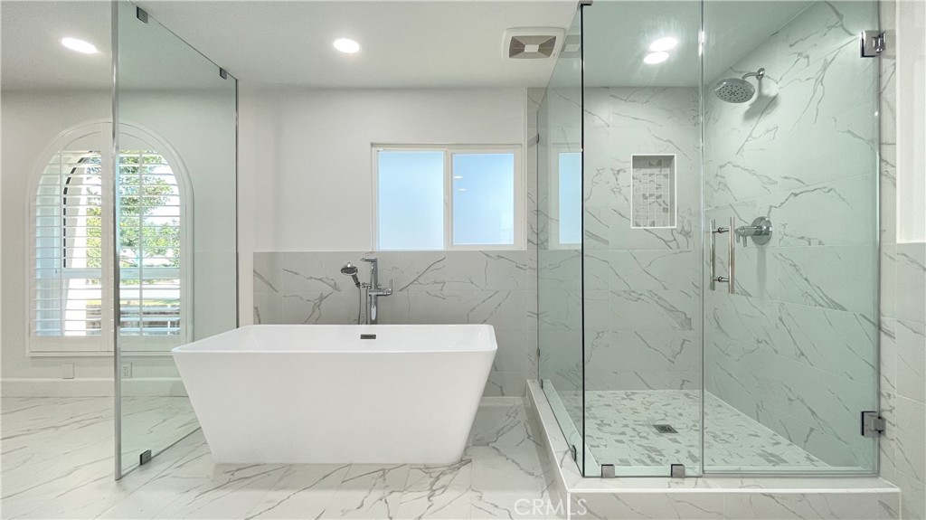 45 Westport Irvine, CA 92620 - Photo 36 of 45 a white bath tub sitting next to a shower