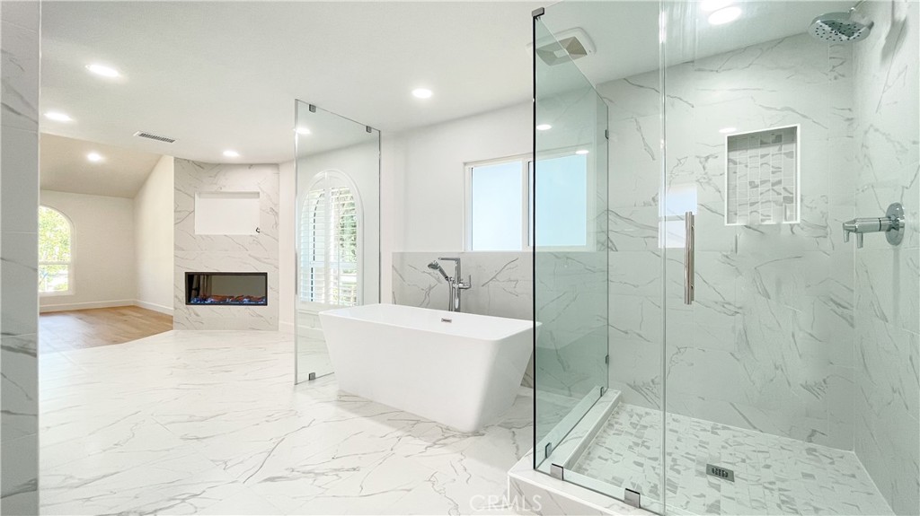 45 Westport Irvine, CA 92620 - Photo 37 of 45 a spacious bathroom with a bathtub and a shower