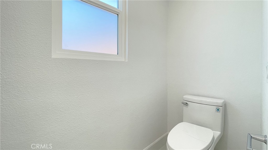 45 Westport Irvine, CA 92620 - Photo 38 of 45 a white toilet sitting in a bathroom next to a white wall